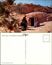 Navajo family at entrance to Hogan Native American Indian desert 1960s postcard picture