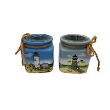 vintage pair of 1980s handpainted lighthouse theme tealight candle holders. picture