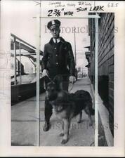 1970 Press Photo Police officer with German Shepherd dog on patrol - pio29315 picture