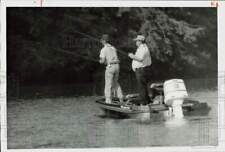 1987 Press Photo Larry Nixon and Stanley Mitchell go fishing in their boat picture