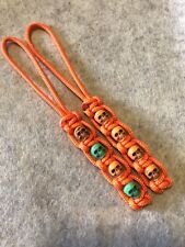325 Paracord Small Hole Knife Lanyard 2pk Orange With Orange And Green Skulls picture