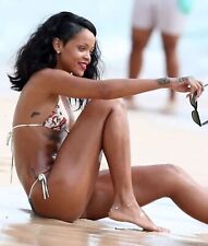 RIHANNA - SITTING ON THE SAND AT THE BEACH WITH A BIKINI ON  picture
