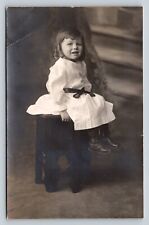 c1909 RPPC Young Girl with Curls Sitting on Stool ANTIQUE Postcard 1456 picture
