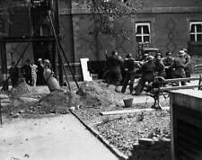 the Bomb Disposal Unit lift a time bomb from the grounds of - 1940 Old Photo 1 picture