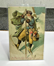 Postcard Old World Santa on Skies Blue and Green Robe Toys c 1906 Antique picture