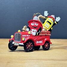 Vintage M&M Riding a Red Fire Truck Christmas Ornament  picture