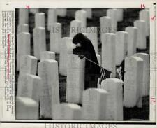 1973 Press Photo Youngster pauses among Arlington National Cemetery markers. picture