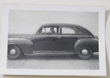 MAN SITTING IN A 1940'S CAR picture