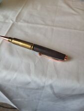 308 caliber bullet pen made with stabilized wood and a genuine brass casing picture