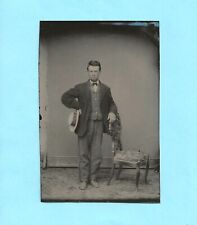 Tintype.  Young man with hand on hip, other on chair. picture