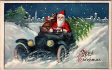 Santa Claus Driving Old Car Full of Toys Tree~City Scene~Christmas~Postcard~k584 picture