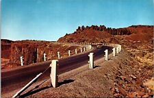 Car Driving US Highway 10 Washington Lava Rock Formations Shear Drops Postcard picture