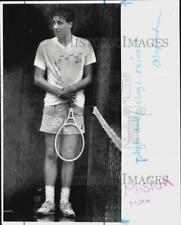 1989 Press Photo Drenched tennis player Mike Masiuk waits out a set in Milford picture