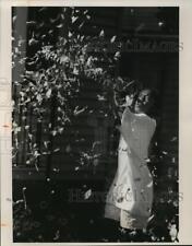 1992 Press Photo Hasina Huntley-Cooper Plays In Leaves Outiside Friend's Home picture