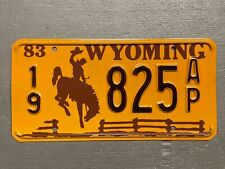 VINTAGE 1983 WYOMING LICENSE PLATE BUCKING BRONCO /FENCE 19-825AP MINT🤠 picture