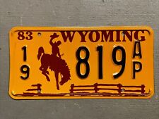 VINTAGE 1983 WYOMING LICENSE PLATE BUCKING BRONCO /FENCE 19-819AP MINT🤠 picture