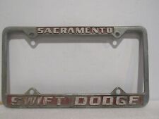 Vintage Sacramento CA Swift Dodge Dealership License Plate Frame Metal Embossed picture