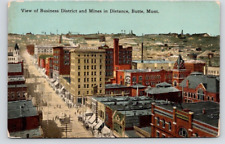 POSTCARD STREET SCENE VIEW OF BUSINESS DISTRICT & MINES IN DISTANC BUTTE MONTANA picture