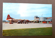 Vintage Des Moines Iowa  Municipal Airport Braniff Prop Airliner Postcard picture