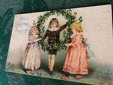 Tuck Postcard Christmas Series Children Holds Christmas Wreath Embossed Unposted picture