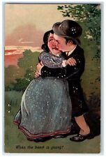 1908 Ugly Couple Kissing Romance When The Heart Is Young Embossed Postcard picture