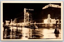 Reno Nevada~Center Street On Rainy Night~Palace Club~Hotel Golden~1930s RPPC picture