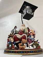 Santa's Work Shop with Lantern, Santa making toys & little Helpers Candle Holder picture