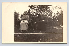 c1904-1918 RPPC Postcard Two Women & Their Dog Posing in Garden picture