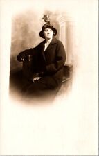 RPPC Woman Fancy Hat Flowers Sitting Turned On Chair c1910s photo postcard HQ8 picture