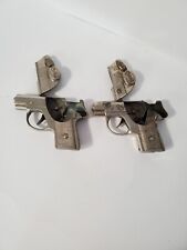 2 Dick Tracy metal cap hand guns    1940 picture