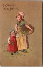 1908 HAPPY NEW YEAR Postcard Two Girls with Basket, Gathering Four-Leaf Clovers picture