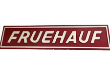 RED PLASTIC FRUEHAUF SIGN  UNUSED with ADHESIVE BACK 2x11 INCHES picture