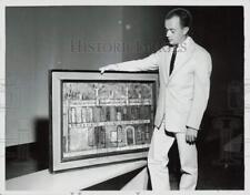 1957 Press Photo Louis Cheney holding a painting - lra49778 picture