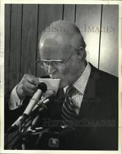 1979 Press Photo Charles Becker sipping drink at podium - saa91328 picture