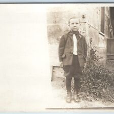 c1910s Handsome Young Man Outdoors RPPC Stone House w Knickerbockers Bowtie A213 picture