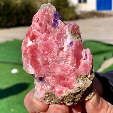 208G  Mineral specimens of natural rhodochrosite coexisting with purple fluorite picture