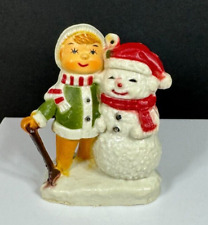 Vintage Snowman in Santa Hat by Child with Shovel Hard Plastic Holiday Ornament picture