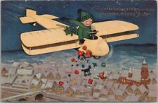 Vintage 1910s German MERRY CHRISTMAS Postcard Boy in Airplane / Toys - UNUSED picture