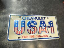 Chevrolet USA-1 Taking Charge Dealer GM License Plate Metal American Flag READ picture