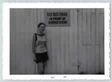 1960s DO NOT PARK IN FRONT OF GARAGE DOORS GIRL SNAPSHOT PHOTOGRAPH VINTAGE picture