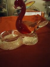 vintage glass ashtrash or trinkets.Glass swan clear and red. real thick. heavier picture