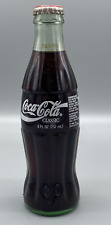 Coca-Cola 100 YEAR Olympic White CLASSIC ON BOTH SIDES 6 1/2 OZ  FULL BOTTLE  picture