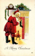 c 1919 Vintage SANTA CLAUS Postcard. Filling A Stocking On The Fireplace Mantle picture
