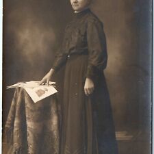 c1910s Concerned Lady Reading Newspaper? RPPC Woman Portrait Real Photo Odd A160 picture