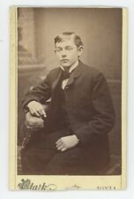 Antique CDV Circa 1870s Handsome Young Man Sitting in Posing Chair Wearing Suit picture