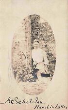 Woman Poses by Tree at Sabel Inn Hamlin Lake Michigan Saubel Inn RPPC Postcard picture