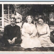 c1910s Group Outdoors in Lawn RPPC Women Man Weird Hairdo Houses Real Photo A261 picture