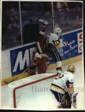 1992 Press Photo University of Wisconsin Hockey player gets knocked down, Duluth picture
