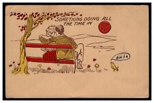 SOMETHING DOING ALL THE TIME IN POSTCARD 1900'S UNDIVIDED BACK COUPLE BENCH TREE picture