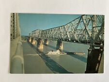 Tennessee~Memphis-Arkansas bridge~through truss~barge~tugboat~Mississippi River picture
